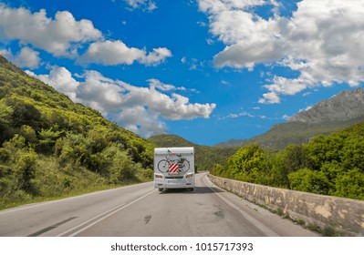 Caravan Car On The Road In Spring Season Green Trees Clouds 