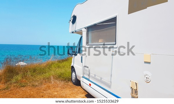 caravan car sea in summer season holidays in the
nature camping