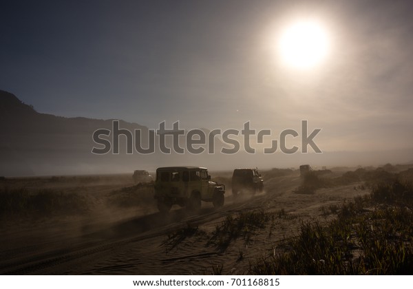 Caravan cars on the\
crater of Bromo\
Mountain