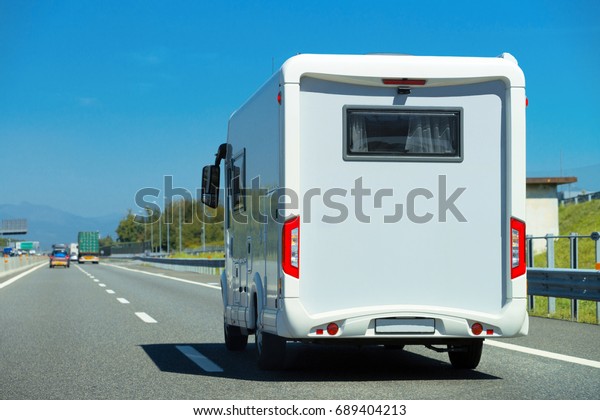 Caravan on the road,\
Switzerland.
