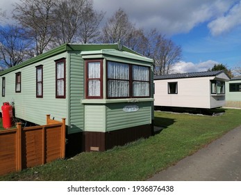 Caravan park camping,Mobile home building of plastic materials gypsum and wooden, the home is static in the middle of beautiful nature.  Bedale Yorkshire, England.03.16.2021.