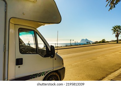 Caravan Rv On Mediterranean Coast In Spain. Gibraltar Rock On Horizon. Roadtrip, Vacation In Mobile Home.