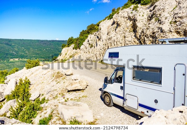 Caravan rv on nature. Verdon Gorge France.\
Motor home camping car driving through mountain landscape.\
Adventure with camper\
vehicle..