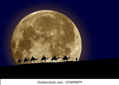 Caravan Silhouette On Background Of The Moon
Night In The Desert. Dubai