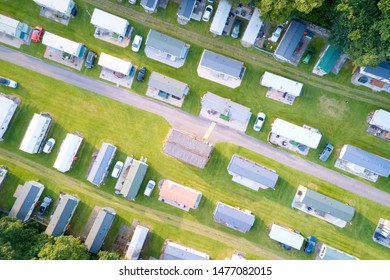 Caravan site park aerial view illuminated by summer sun