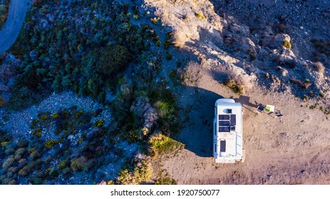 Caravan With Solar Panels On Roof Camping On Cliff Sea Shore. Mediterranean Region Of Villaricos, Almeria, Eastern Andalusia, Spain.