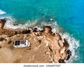 Caravan With Solar Panels On Roof Camping On Cliff Sea Shore. Mediterranean Region Of Mazarron In Murcia, Spain.