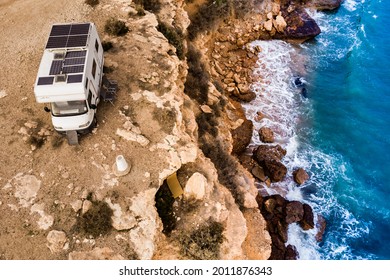 Caravan With Solar Panels On Roof Camping On Cliff Sea Shore. Mediterranean Region Of Mazarron In Murcia, Spain.