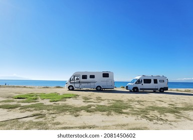 caravans cars beside sea beach travel  in autumn , greece