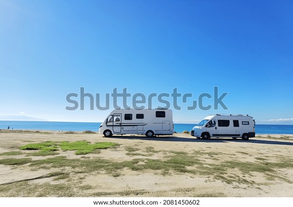 caravans\
cars beside sea beach travel  in autumn ,\
greece
