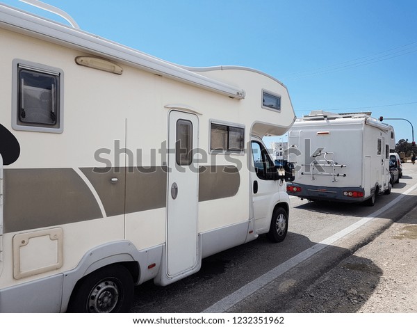 caravans cars travel holidays on the road trip\
adventure in summer