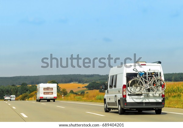 Caravans on the road in\
Switzerland.