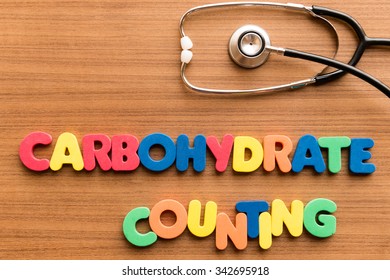 carbohydrate counting colorful word on the wooden background with stethoscope