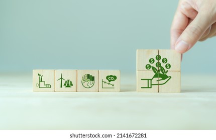 Carbon Credit Concept. Tradable Certificate To Drive Industry And Company In The Direction Of Low Emissions In Efficiency Cost.  Wooden Cubes With CO2, US Dollars And Carbon Offsetting Solution Icons.