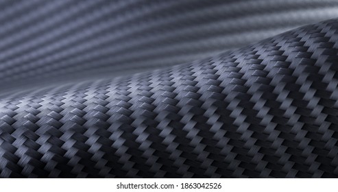 Carbon fiber composite raw material. Texture panorama of black carbon fiber.