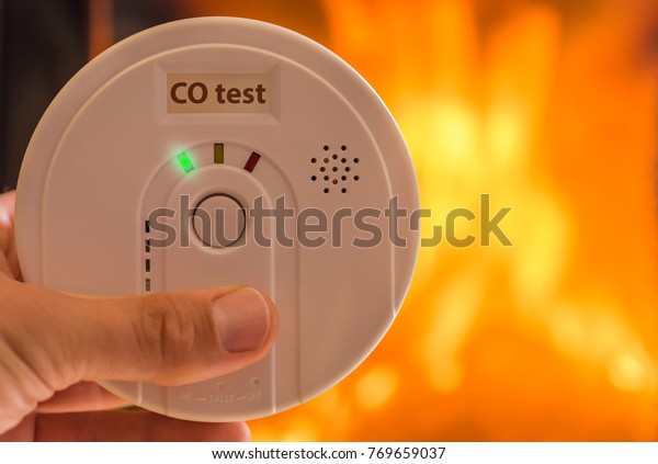 Carbon monoxide alarm in the air for rooms\
heated by stoves and\
fireplaces