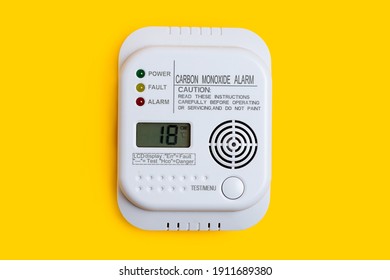 Carbon Monoxide Detector On A Yellow Background CO Detector