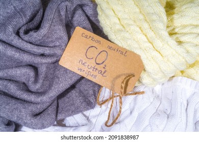 Carbon Neutral, CO2-free Concept Product. Natural Organic Cotton Clothing, With CO2 Neutral Tag Verified, On The Desk At Home Or In A Store