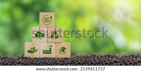 Carbon neutral and net zero concept natural environment Climate-neutral long-term strategy greenhouse gas emissions targets Wooden block with green net center icon