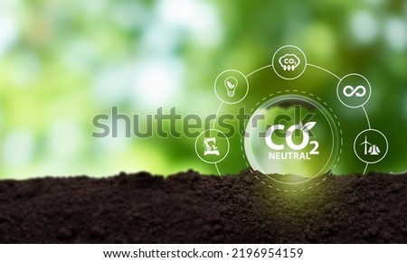 Carbon neutral sustainable development concept. Green industry. Net zero greenhouse gas emissions target 2050. Climate neutral long term strategy. Carbon neutral symbols on green view background .
