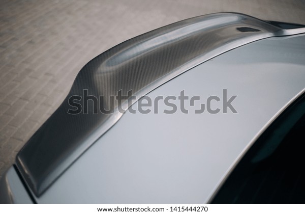 Carbon spoiler on the\
trunk of modern car