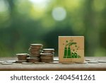 Carbon Tax, Tax on carbon emission. Coins stack with CO2 icons on wooden cubes for Environmental and social responsibility businesses. Taxation for nature pollution.Carbon credit.ESG fund, CO2 tax,
