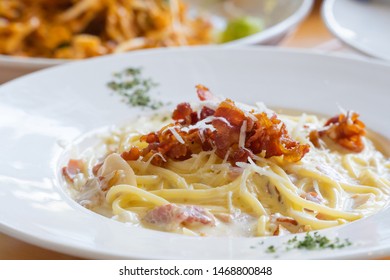 Carbonara spaghetti, the delicious italian food in white plate.