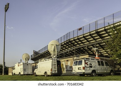 CARBONDALE, IL/USA - AUGUST 21, 2017: Early In The Morning, Three Satellite Trucks Stand Parked By A Stadium On The Campus Of Southern Illinois University In Readiness For The Great American Eclipse.