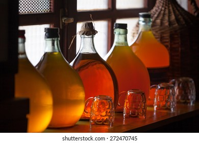 Carboys with hand made liqueur - Shutterstock ID 272470745