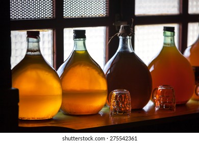 Carboys with hand made liqueur - Shutterstock ID 275542361