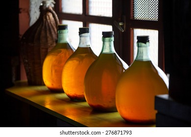 Carboys with hand made liqueur - Shutterstock ID 276871793