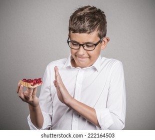 Carbs Cravings. Portrait Teenager Boy Craving Cake Confused Funny Looking Man Trying To Withstand Resist Temptation To Eat Sweet Tart Isolated Grey Background. Facial Expression Emotion Reaction