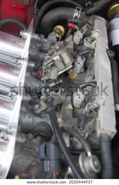 Carbureted engine mechanical detail,\
transportation technology in Latin America\
