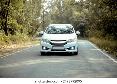 Car-car on the road-beautiful car-vehicle-4 wheel vehicle-front view-road-white car-white.
