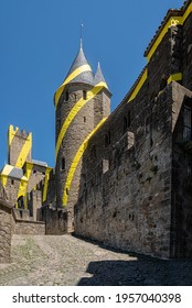Carcassona, Languedoc, France; July 23, 2018: Aude Gate of the medieval city of Carcassona with the decoration of yellow circles by Felice Varini
