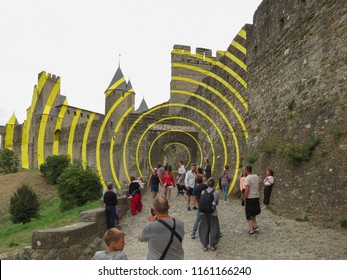CARCASSONNE, FRANCE - CIRCA AUGUST 2018: yellow circles contemporary art by Felice Varini