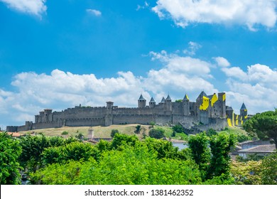 Carcassonne, France - June 29 2018:Designed by Felice Varini,Thin, painted aluminium sheets on the walls and towers,a succession of yellow 'eccentric concentric circles.
