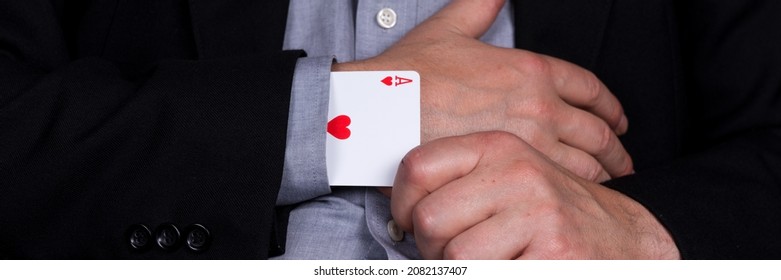Card ace of hearts in the sleeve of the black suit. Panoramic image