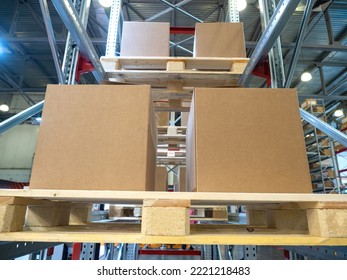 Card Boxes On Storage Racks. Steel Shelves With Pallets. Storage Distribution Company. Storage Logistics Manufacturing Enterprises Concept. Place To Store Company Goods. Warehouse Building Indoors