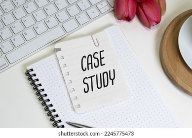 Card with case study text on a yellow background with office items. Business concept.