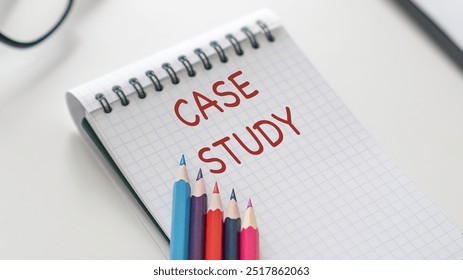 Card with case study text on a yellow background with office items. Business concept.