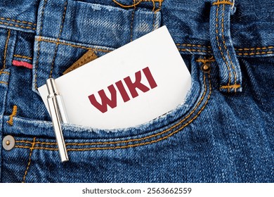 A card labeled with Wiki sits snugly in the pocket of denim jeans next to a silver pen, illustrating a blend of casual style and modern technology concepts in everyday life.