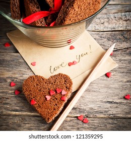 Card With Message Love You In The Letter And Chocolate Cookies In The Shape Of Heart At Valentine Day