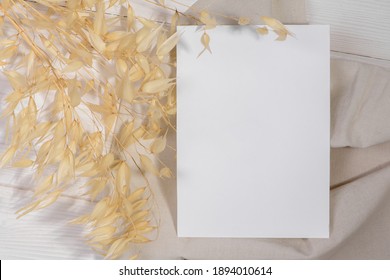 Card mockup template, empty stationery card with dry plants flower and natural linen on a white background and design element for wedding invitation, rsvp, thank you card, greeting