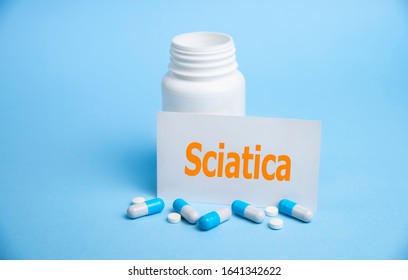 a card with the name of the diagnosis - sciatica. Selective focus. Medical concept.