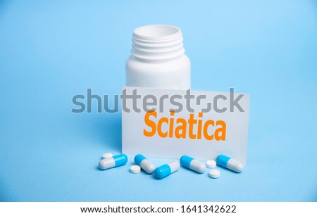 a card with the name of the diagnosis - sciatica. Selective focus. Medical concept.