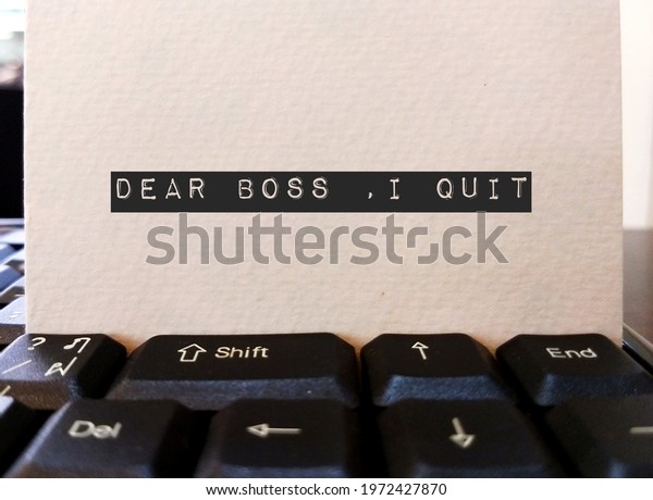 Card on keyboard typed DEAR BOSS I QUIT, concept\
of employee making decision to quit corporate day job , unhappy\
worker giving up working 9 to 5 , change job or start their own\
business