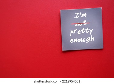 Card Paper On Red Copy Space Background With Handwritten Text I AM NOT PRETTY ENOUGH Crossed Off NOT To Overcome Self Criticism, Boost Self Esteem, Validation And Acceptance