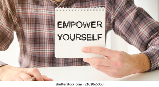 Card with text EMPOWER YOURSELF on hand. You can use in business, marketing and other concepts. Messege of the day.