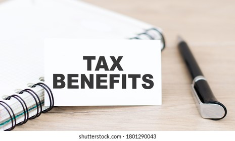 A Card With Text Tax Benefits On The Table